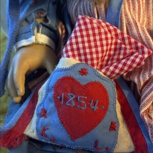 American Girl Doll with Red and Blue Outfit